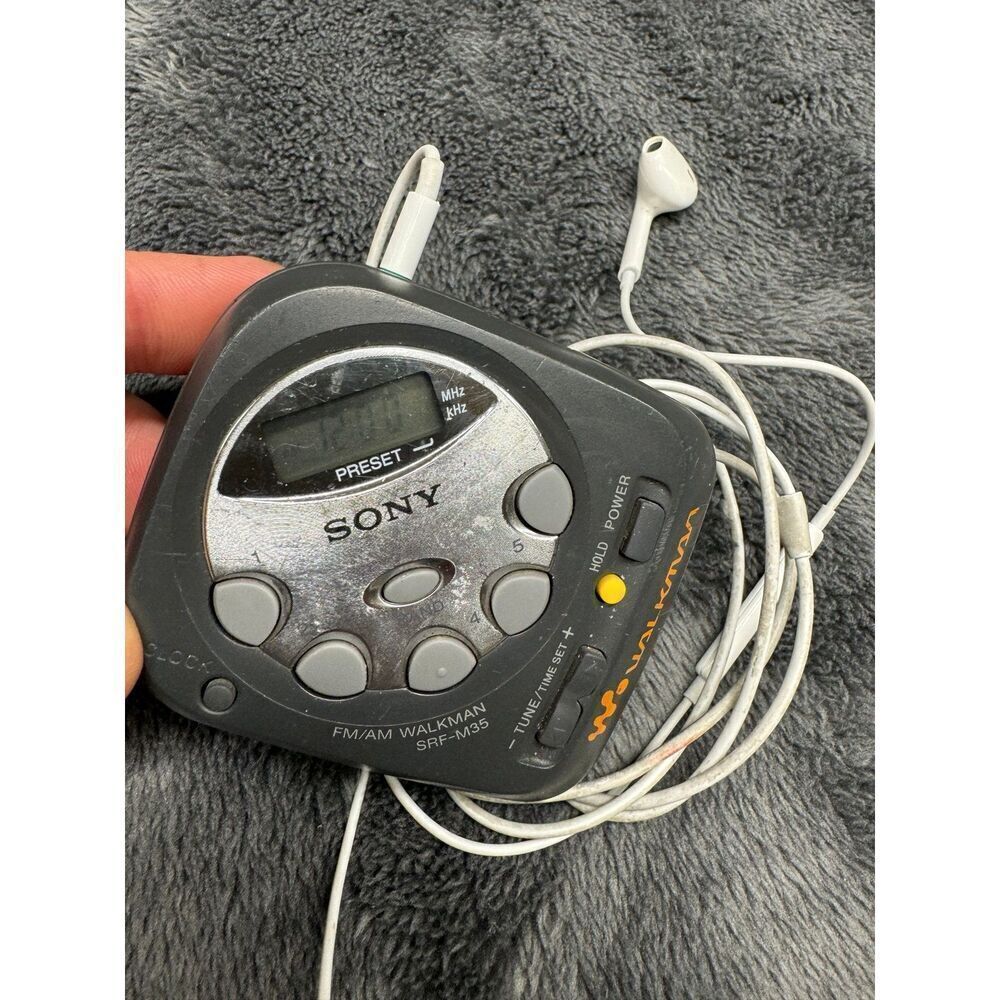 Vintage Compact Sony Am/FM Walkman with Apple Earpods w/Mic. Works great!  Runs